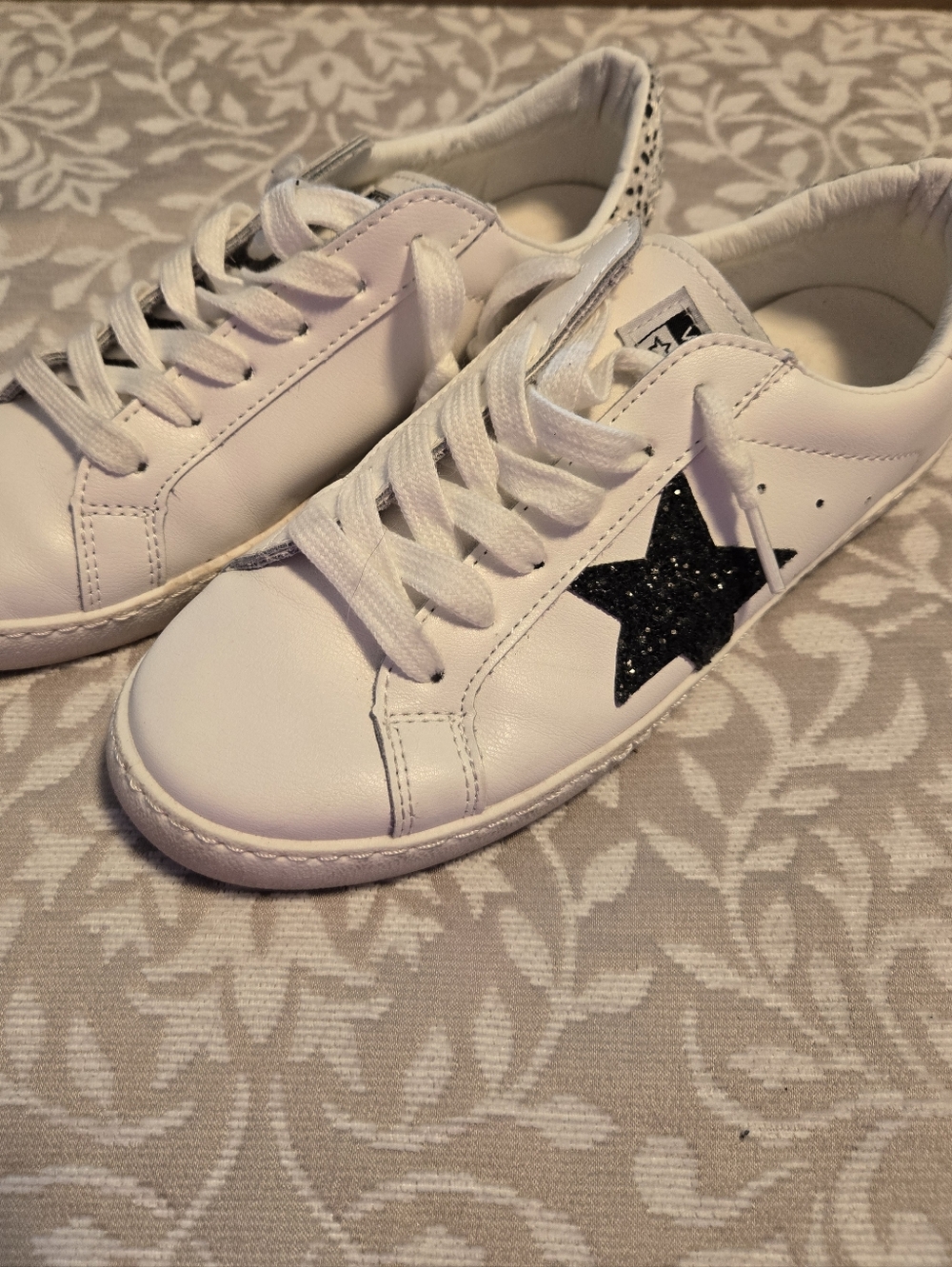 White Sneakers with Black Star Accent